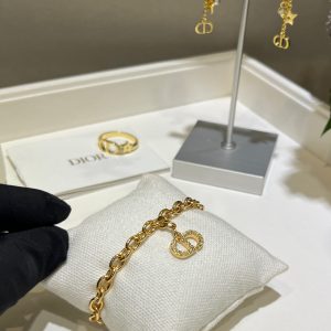 𝐃𝐢𝐨 * 25-year-old, fully encrusted CD pendant in champagne gold with a bracelet.