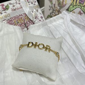 Dior’s new gold-lettered crystal bracelet.
