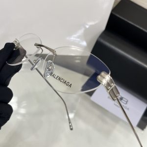 Balencig* frameless glasses.