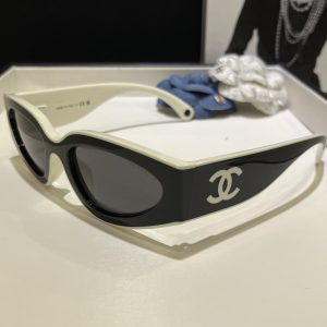 Chane* Panda-colored sunglasses.